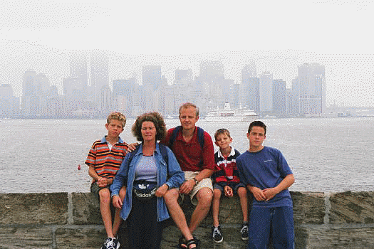 Family with fruit backdrop